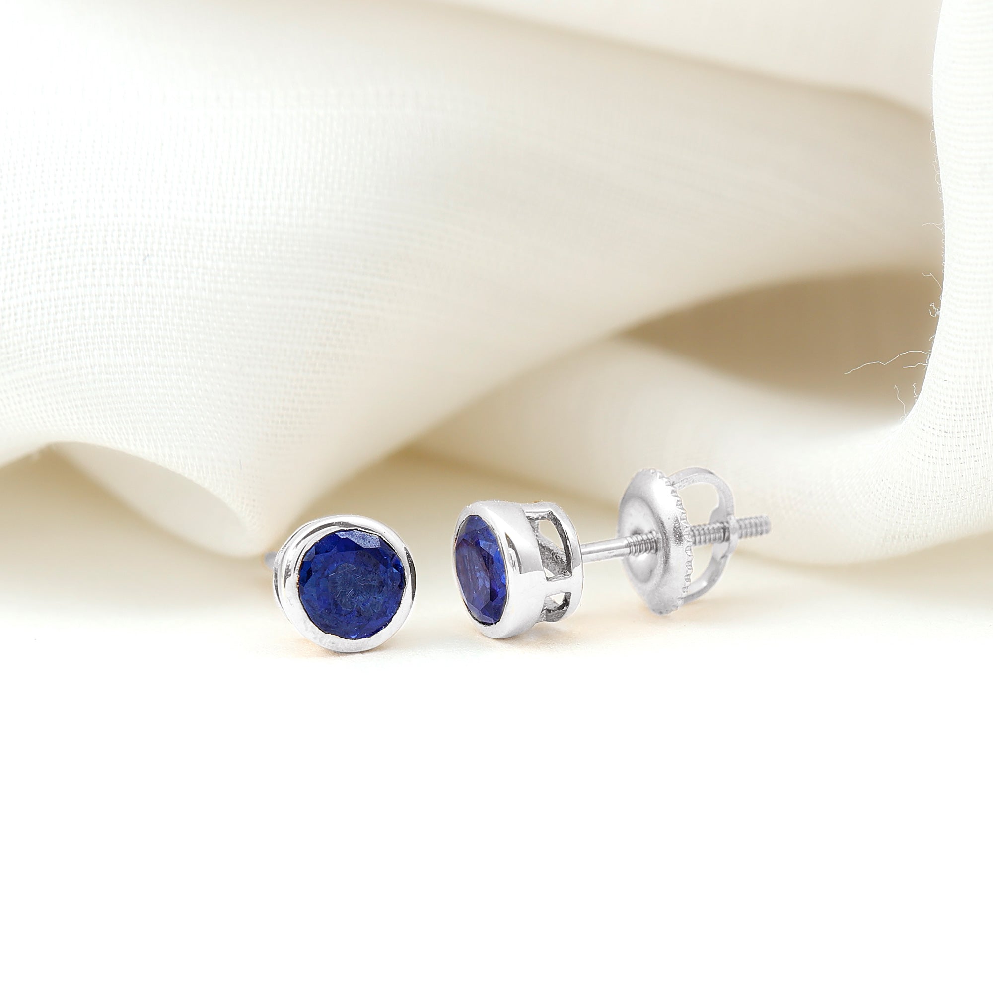 Rosec Jewels-Bezel Set Lab Grown Blue Sapphire Stud Earrings With Screw Back