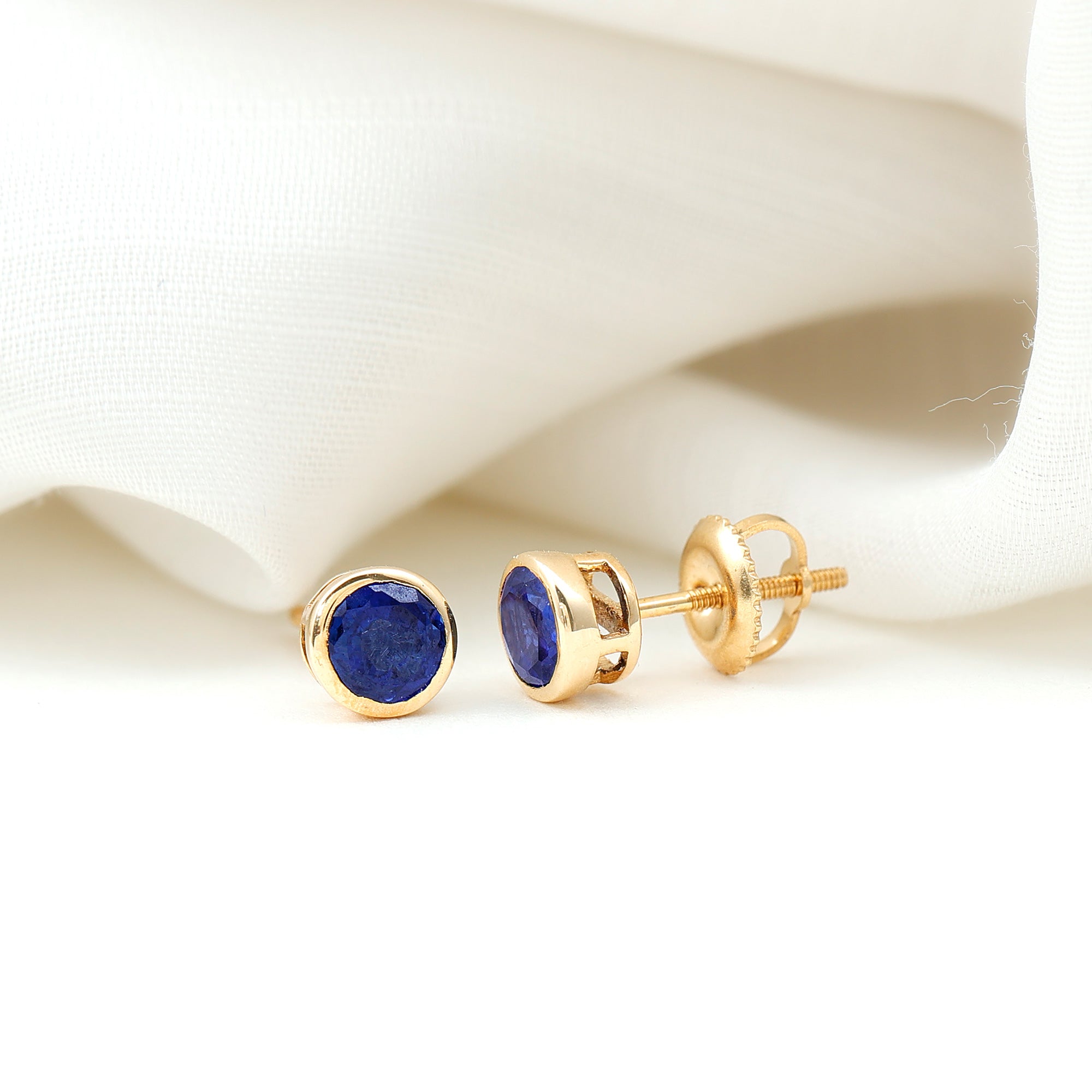 Rosec Jewels-Bezel Set Lab Grown Blue Sapphire Stud Earrings With Screw Back