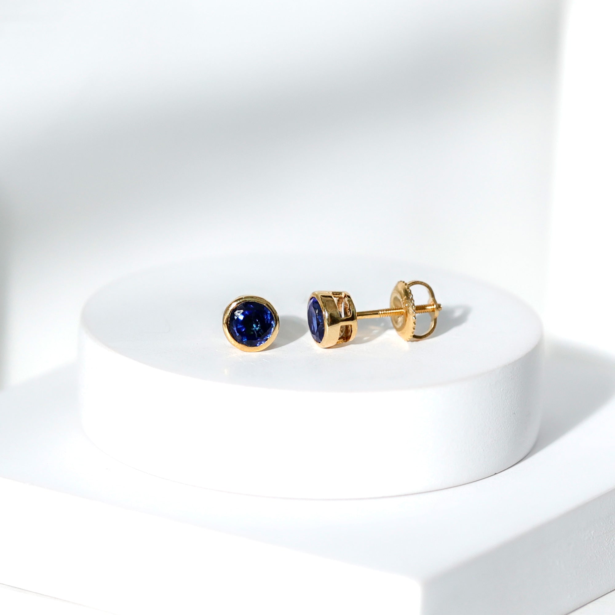 Rosec Jewels-Bezel Set Lab Grown Blue Sapphire Stud Earrings With Screw Back