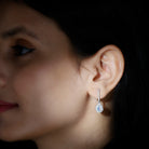 2.75 CT Ethiopian Opal Bridal Teardrop Silver Hoop Earrings with Moissanite Accent - Rosec Jewels