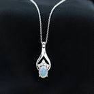 Oval Ethiopian Opal and Moissanite Silver Teardrop Pendant - Rosec Jewels